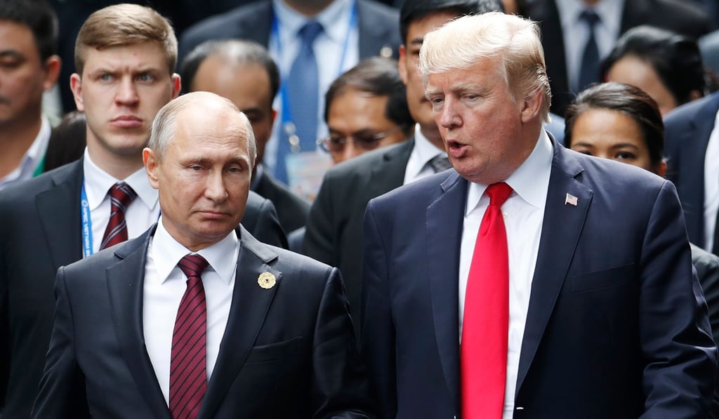 (In this file photo taken on November 11, 2017, US President Donald Trump (right) and Russia's President Vladimir Putin talk as they make their way to take the “family photo” session during the Asia-Pacific Economic Cooperation summit in the central Vietnamese city of Da Nang. Photo: Agence France-Presse (In this file photo taken on November 11, 2017, US President Donald Trump (right) and Russia's President Vladimir Putin talk as they make their way to take the “family photo” session during the Asia-Pacific Economic Cooperation summit in the central Vietnamese city of Da Nang. Photo: Agence France-Presse
