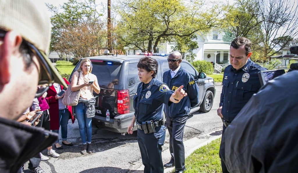 A police officer tells members the media that the Austin bomber's neighbourhood is being evacuated on Wednesday in Pflugerville, Texas. Photo: Getty Images via AFP