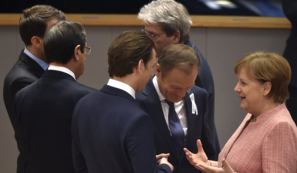 German Chancellor Angela Merkel (R) chats with European Council President Donald Tusk (2-R) and Austrian Chancellor Christian Kern (C) during a European Council meeting in Brussels, Belgium, on March 22, 2018. Photo: EPA-EFE