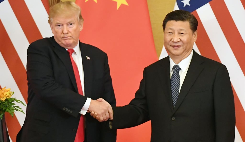 US President Donald Trump shakes hands with Chinese President Xi Jinping on November 9. Trump has since branded China - along with Russia - a major threat to the US. Photo: Kyodo US President Donald Trump shakes hands with Chinese President Xi Jinping on November 9. Trump has since branded China - along with Russia - a major threat to the US. Photo: Kyodo