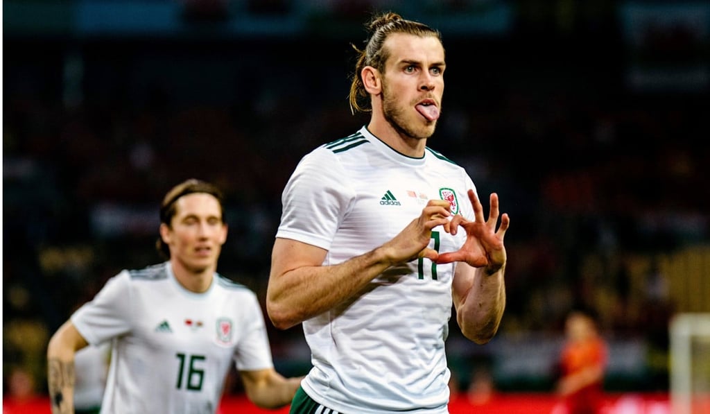 Gareth Bale celebrates scoring against China.