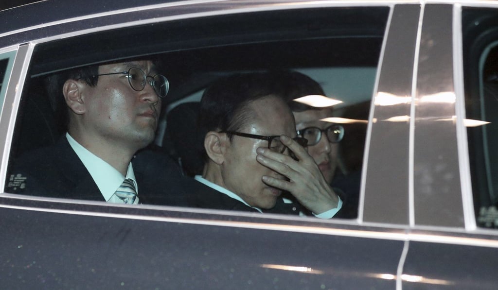 Lee is seen arriving at the detention centre. He is the latest in a series of disgraced leaders embroiled in scandals and other problems after leaving office. Photo: Yonhap via AP Lee is seen arriving at the detention centre. He is the latest in a series of disgraced leaders embroiled in scandals and other problems after leaving office. Photo: Yonhap via AP
