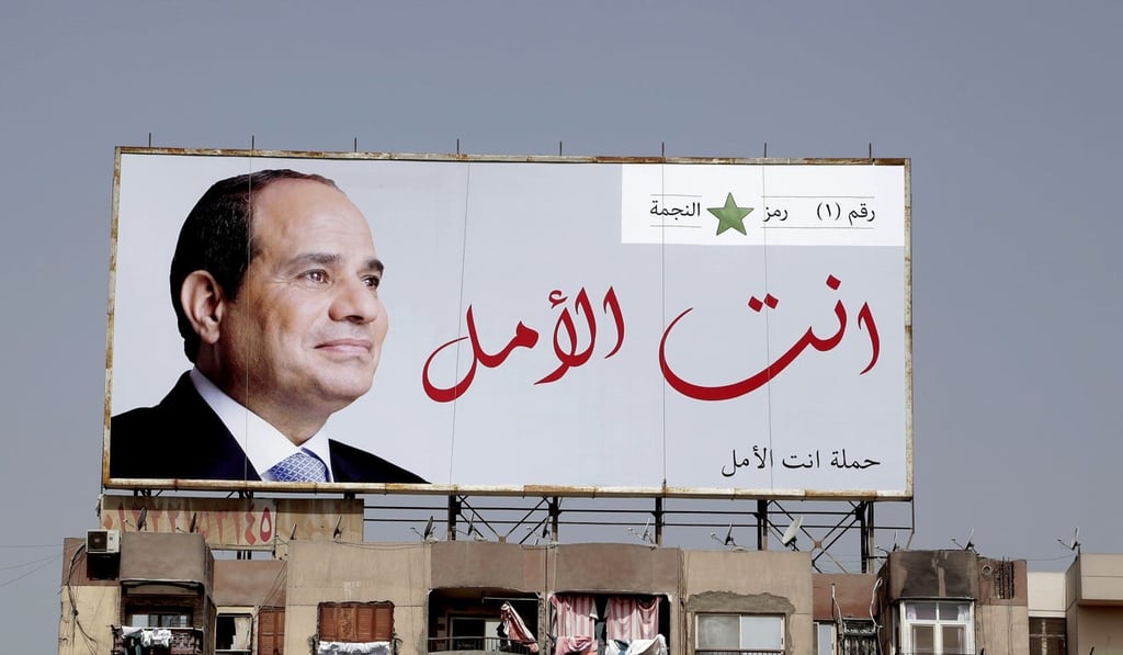 Election campaign banners for Egyptian President Abdel-Fattah el-Sisi hang near the Giza Pyramids. Egyptians on social media are mocking the ubiquitous banners of el-Sisi raised ahead of this month’s election. Photo: AP