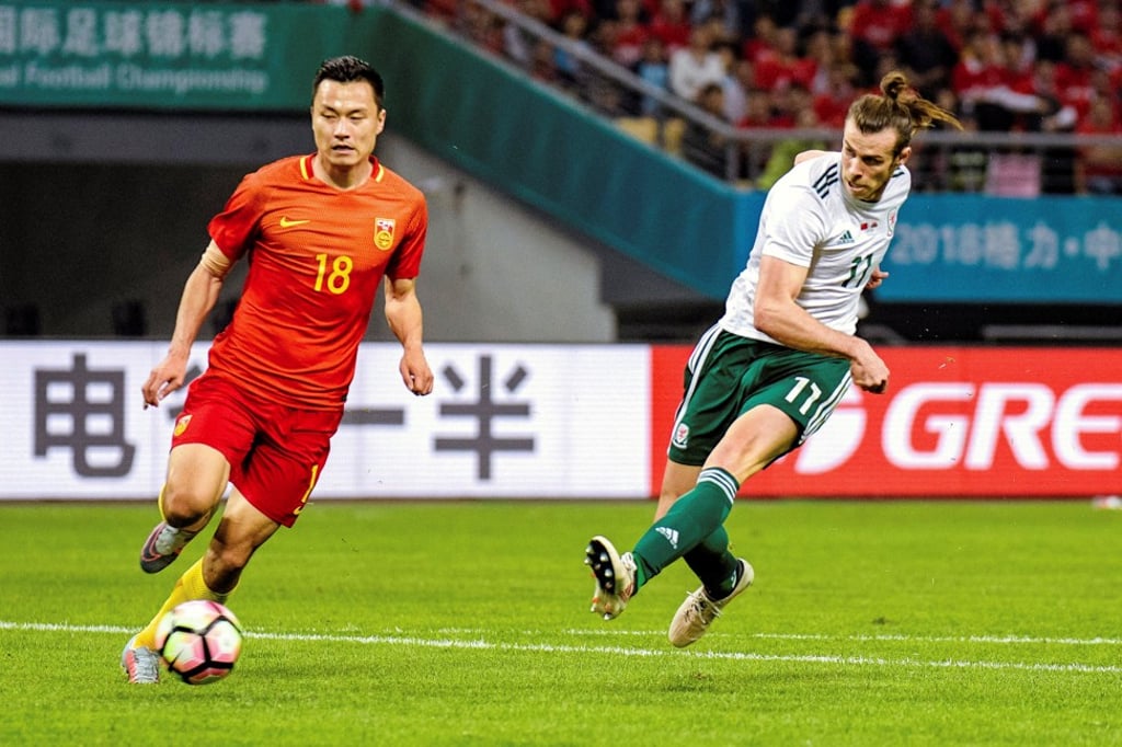 Gareth Bale, who scored a hat-trick against China, fires off a shot. Photo: Reuters