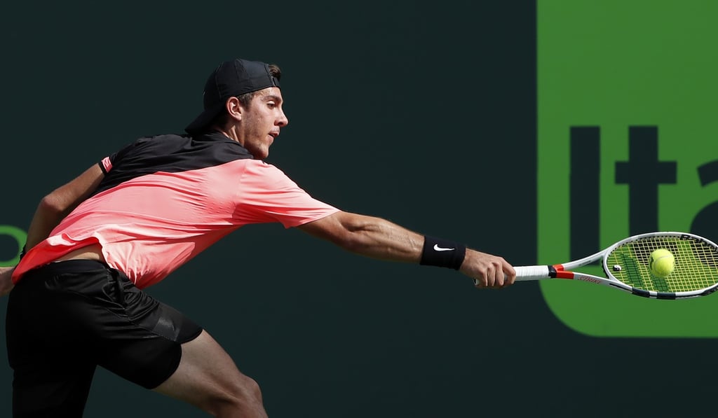 Thanasi Kokkinakis of Australia reaches for a backhand against Roger Federer of Switzerland at the Miami Open. Photo: USA Today