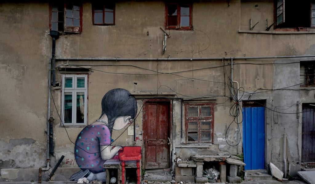 A wall mural by French street artist Seth in a backstreet of Shanghai.