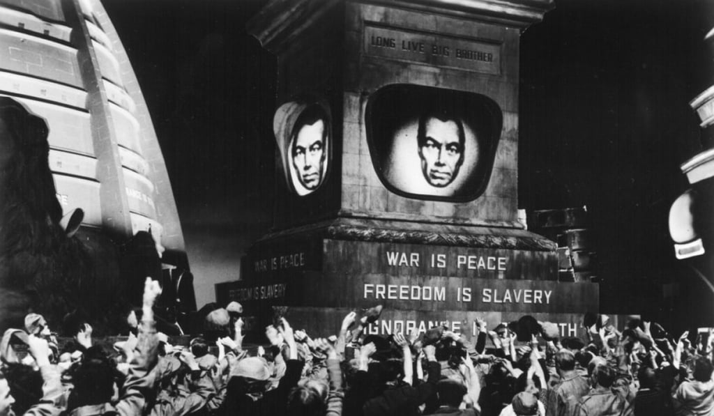 A still from a film adaptation of George Orwell’s Nineteen Eighty-Four, in which the public of Airstrip One pay homage to the omnipresent Big Brother. Photo: Handout