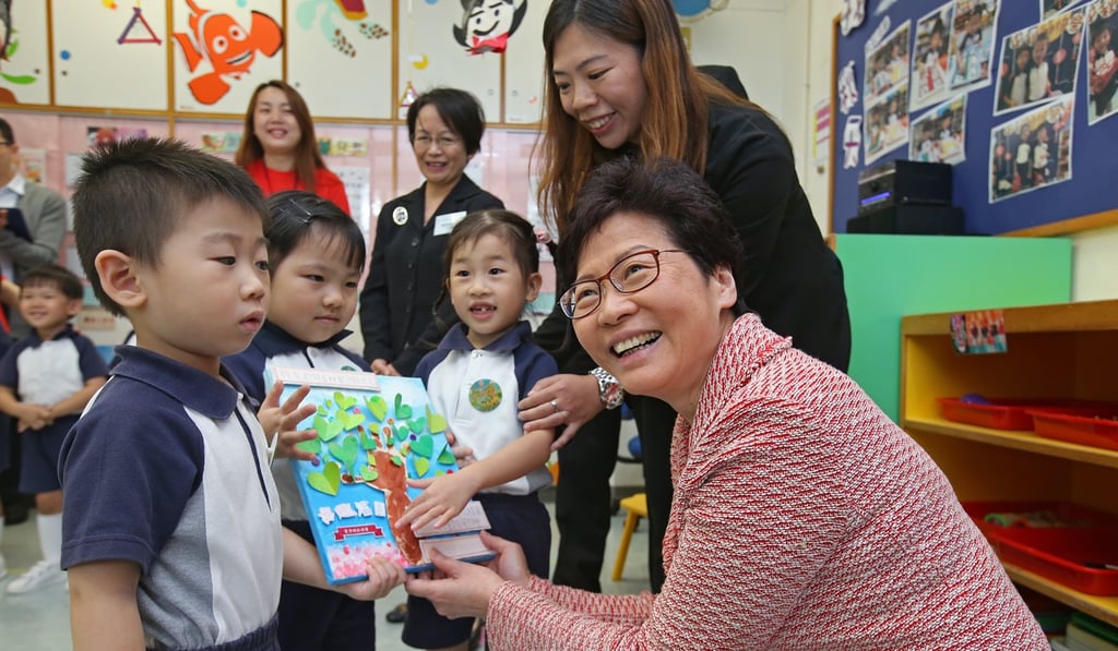 Students present a gift to Chief Executive Carrie Lam during her visit to a kindergarten in Tsz Wan San in October last year. Lam’s government has pledged more education funding and overseen task forces on education reform, but faced criticism over her choice of changes. Photo: David Wong