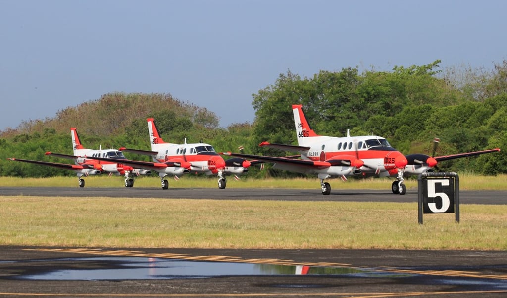 The three Beechcraft TC90 surveillance planes taxi down a runway on their arrival from Japan for a transfer ceremony to the Philippine Navy at the Naval Air Group headquarters in Sangley Point, south of Manila on Monday. Photo: Reuters