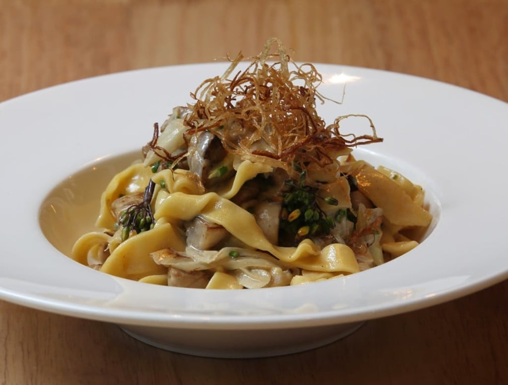 Fukuoka chicken tagliatelle with creamy broth. Photo: Roy Issa