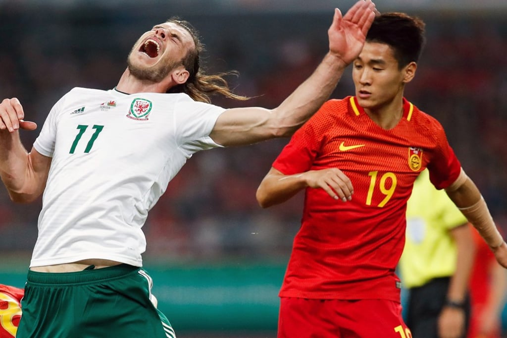 Some of China’s players covered up their tattoos against Wales. Photo: Reuters