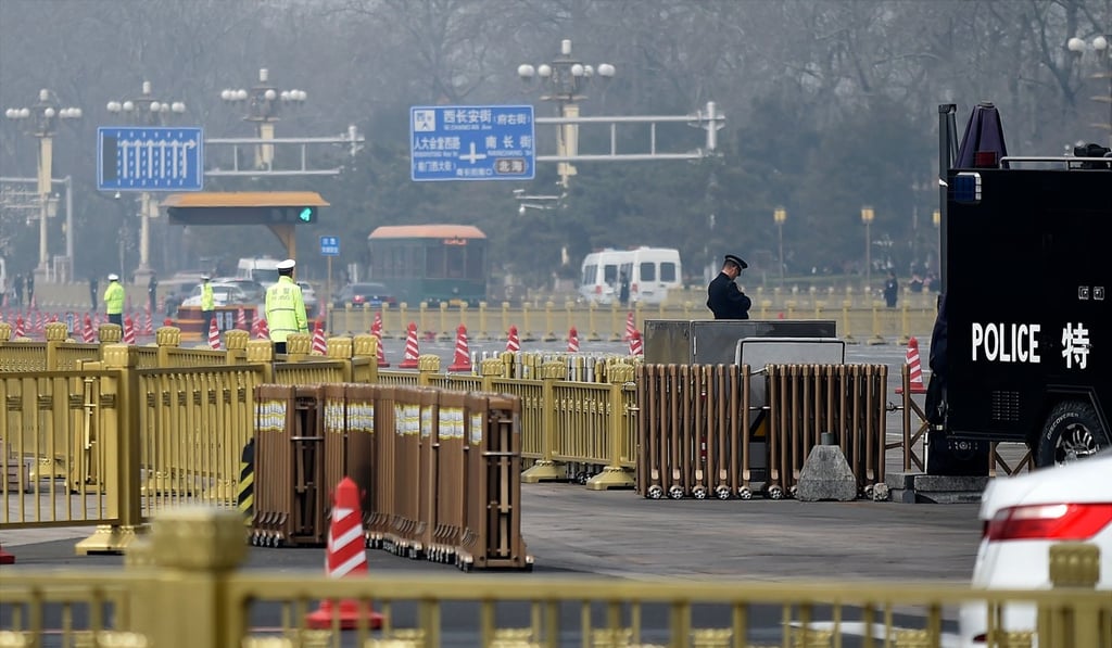 Policemen block a road near Tiananmen Square in Beijing on March 28, after Japanese media reported the arrival of a special North Korean train, met by an honour guard under tight security, suggesting a delegation headed by Kim Jong-un. Photo: AFP