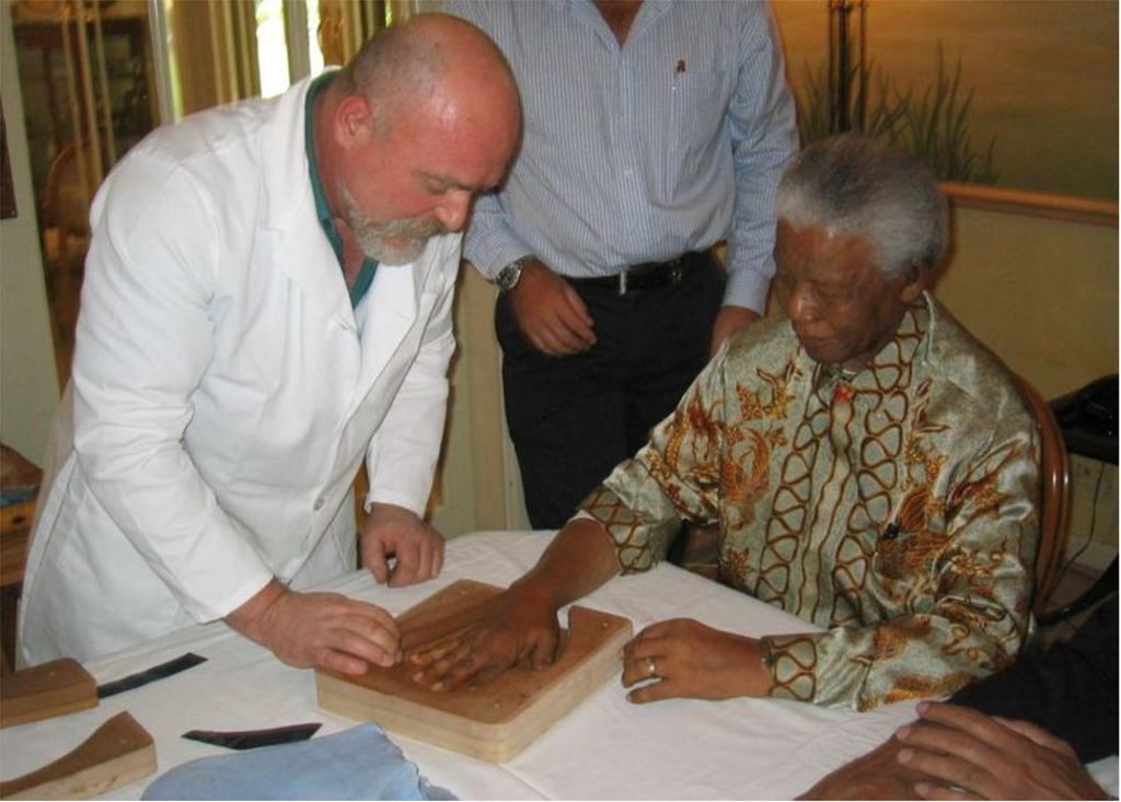 Making the gold castings of Nelson Mandela’s hand. Photo: Malcolm Duncan