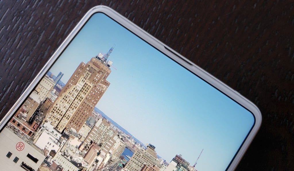 The very slim bezel up top houses an earpiece that doubles as a speaker. Photo: Ben Sin