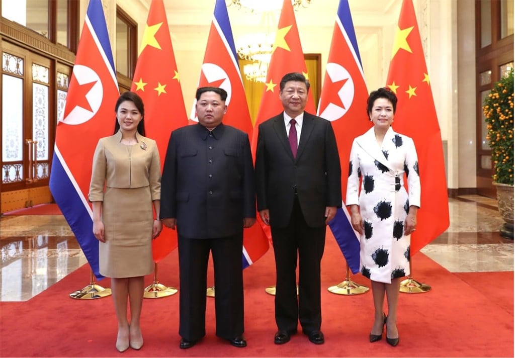 North Korean leader Kim Jong-un and his wife Ri Sol-ju, and Chinese President Xi Jinping and First Lady Peng Liyuan, pose for a historic moment in Beijing. Photo: Xinhua