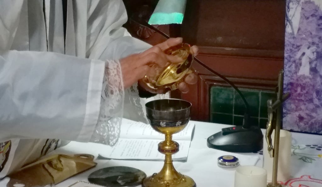 Father Matthew says mass at his underground church. Photo: SCMP Father Matthew says mass at his underground church. Photo: SCMP