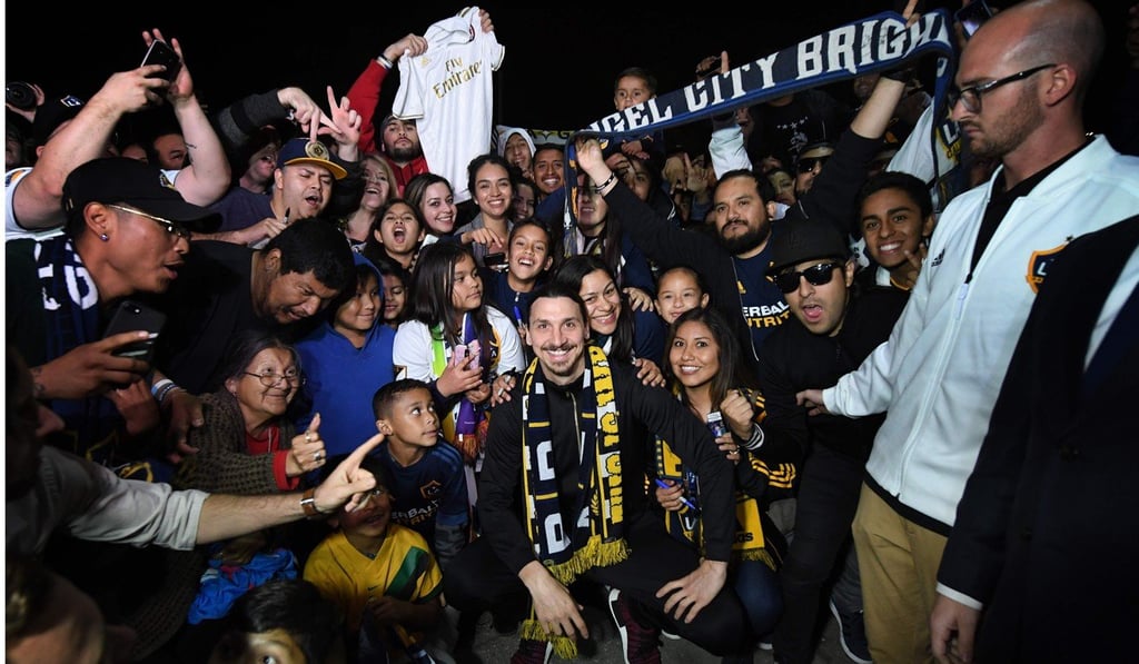 Zlatan Ibrahimovic is greeted by fans at Los Angeles International Airport. Photo: AFP