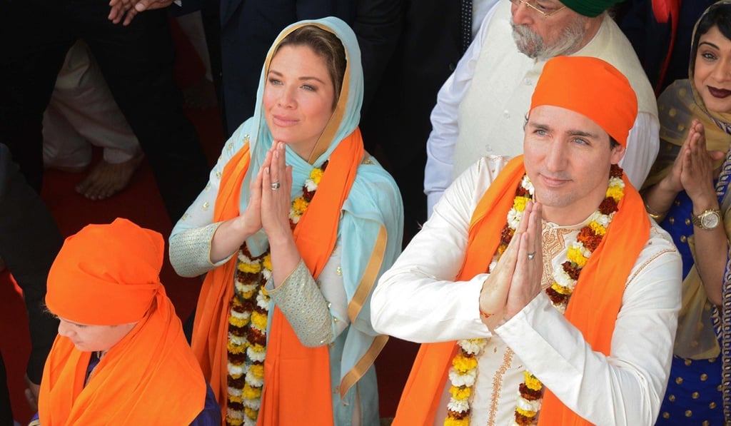 Canadian Prime Minister Justin Trudeau (right) along with his wife Sophie Gregoire pay their respects at the Sikh Golden Temple in Amritsar on February 21. Photo: Agence France-Presse