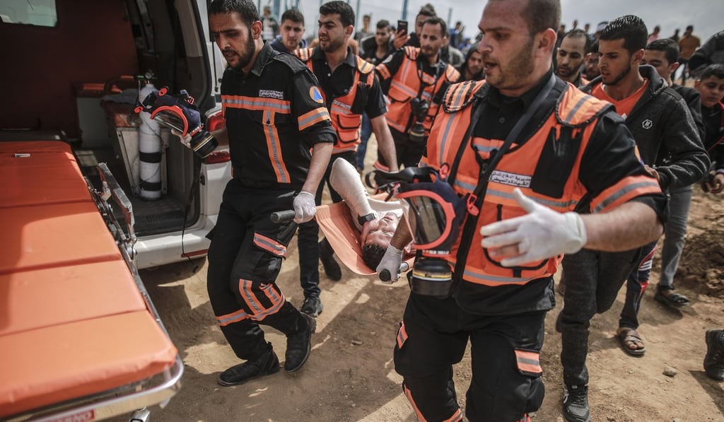 A wounded Palestinian is evacuated during clashes at the border fence between Gaza Strip and Israel. Photo: Xinhua A wounded Palestinian is evacuated during clashes at the border fence between Gaza Strip and Israel. Photo: Xinhua
