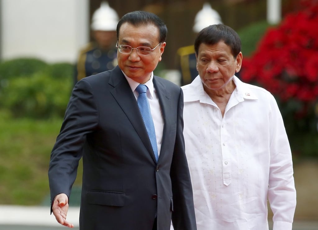 Philippine President Rodrigo Duterte (right), pictured with Chinese Premier Li Keqiang when they met in Manila in November, has repeatedly expressed his preference for resource-sharing arrangements with Beijing to help resolve South China Sea disputes. Photo: AP