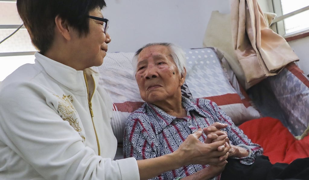 Lee Tsz-yau (right) is aged 107 and her daughter Tse Pui-king is worried about keeping her mother in a privately-run care home. Photo: Edward Wong