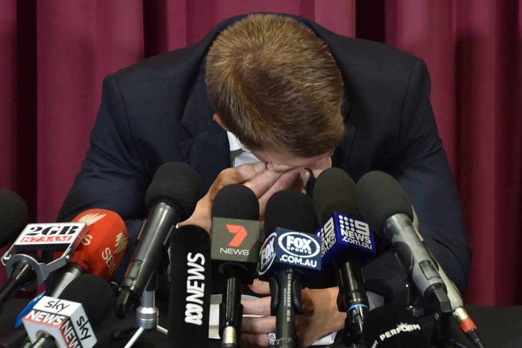 Warner cries during his press conference at the Sydney Cricket Ground. Photo: AFP Warner cries during his press conference at the Sydney Cricket Ground. Photo: AFP