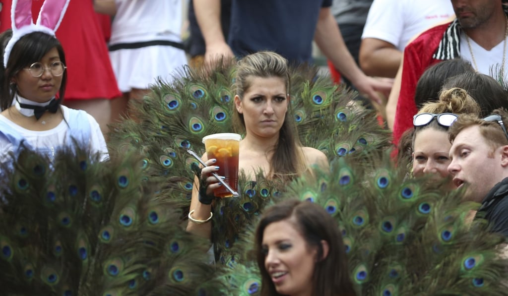 Wearing a peacock costume doesn’t actually look like that much fun. Photo: K. Y. Cheng