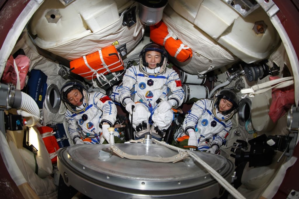 This undated photo released in 2012, shows three astronauts taking part in a training exercise to simulate China’s first manned docking mission between the Shenzhou-9 spaceship and the Tiangong-1 space lab module. Photo: Xinhua