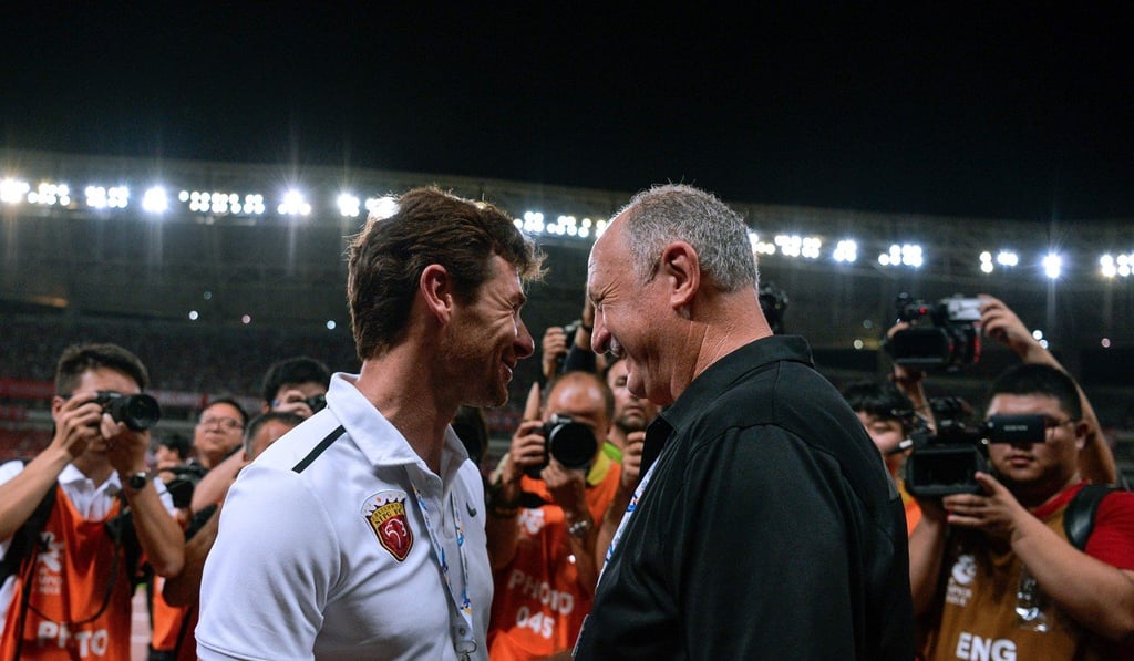 Shanghai SIPG's head coach Andre Villas-Boas greets Guangzhou Evergrande's head coach Luiz Felipe Scolari prior to the AFC Champions League quarter-final football match in Shanghai. Photo: AFP
