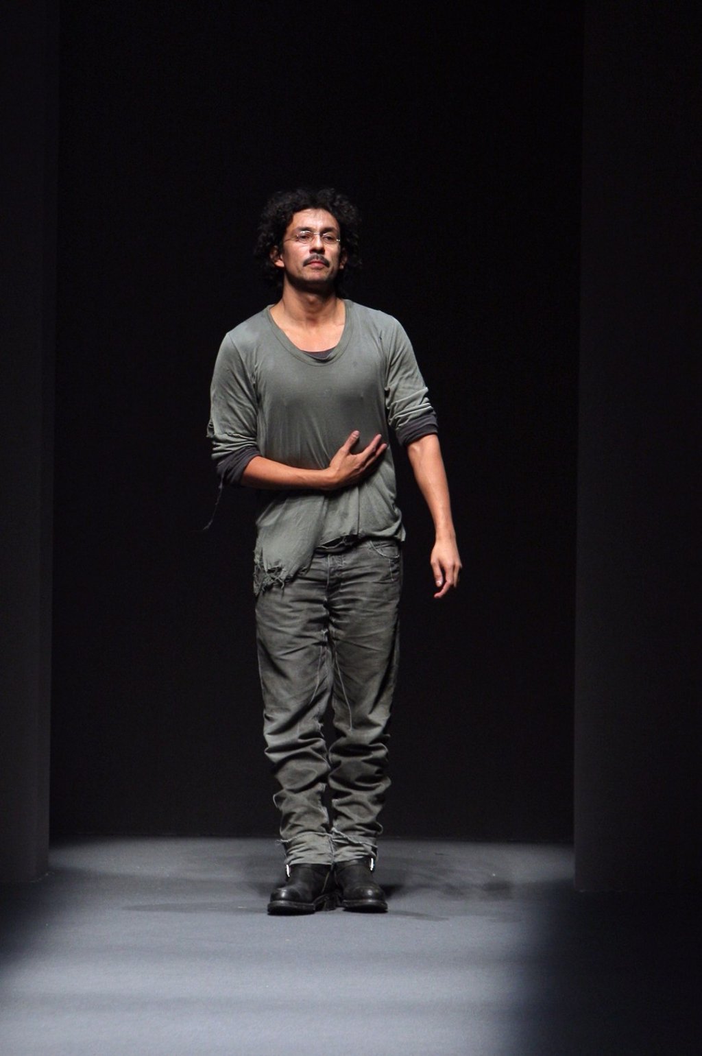 Colombian-born French designer Haider Ackermann acknowledges the public at the end of his autumn/winter 2009 ready-to-wear collection show in Paris. Photo: AFP