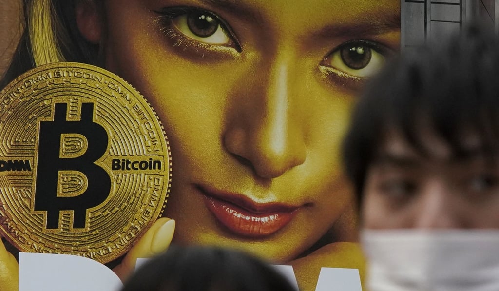 In this February 11 photo, a huge advertisement of bitcoin is displayed near the Shibuya railway station in Tokyo. Bitcoin researchers find the cryptocurrency overvalued. Photo: AP In this February 11 photo, a huge advertisement of bitcoin is displayed near the Shibuya railway station in Tokyo. Bitcoin researchers find the cryptocurrency overvalued. Photo: AP