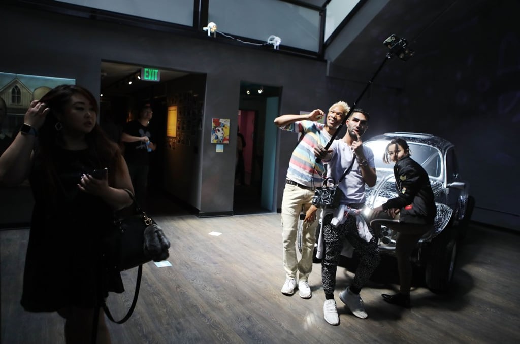 People taking a group selfie on opening day at the Museum of Selfies. Photo: AFP People taking a group selfie on opening day at the Museum of Selfies. Photo: AFP