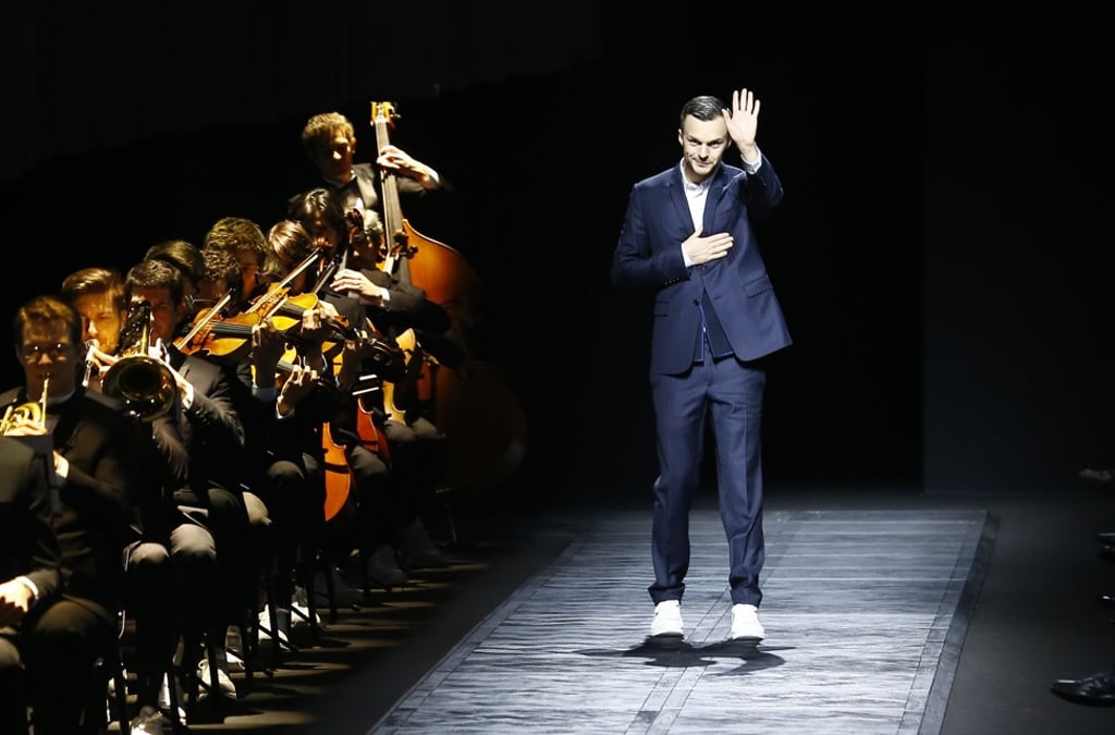 Belgian fashion designer Kris van Assche waves after the presentation of Dior's men's fall-winter 2015/2016 collection presented in Paris, France. Christian Dior has announced on March 19, 2018 that its long-time menswear designer Kris Van Assche is to leave the Parisian fashion house. Photo: AP