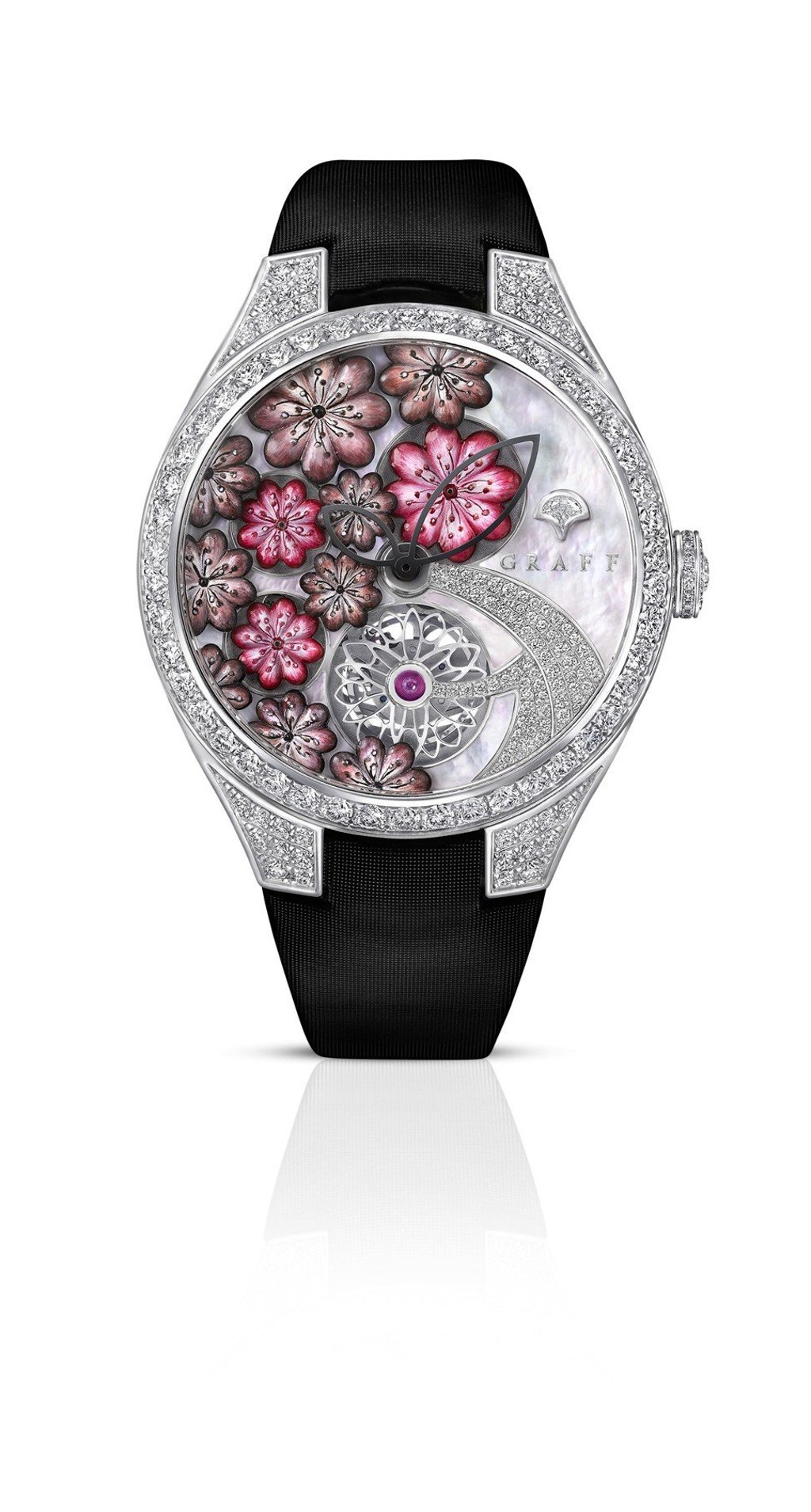 Graff. The MasterGraff Floral Tourbillon 38mm, set in white gold, features white gold hand-cut flowers on its pink mother-of-pearl dial, and is embellished with 4.49ct of diamonds. Price on request