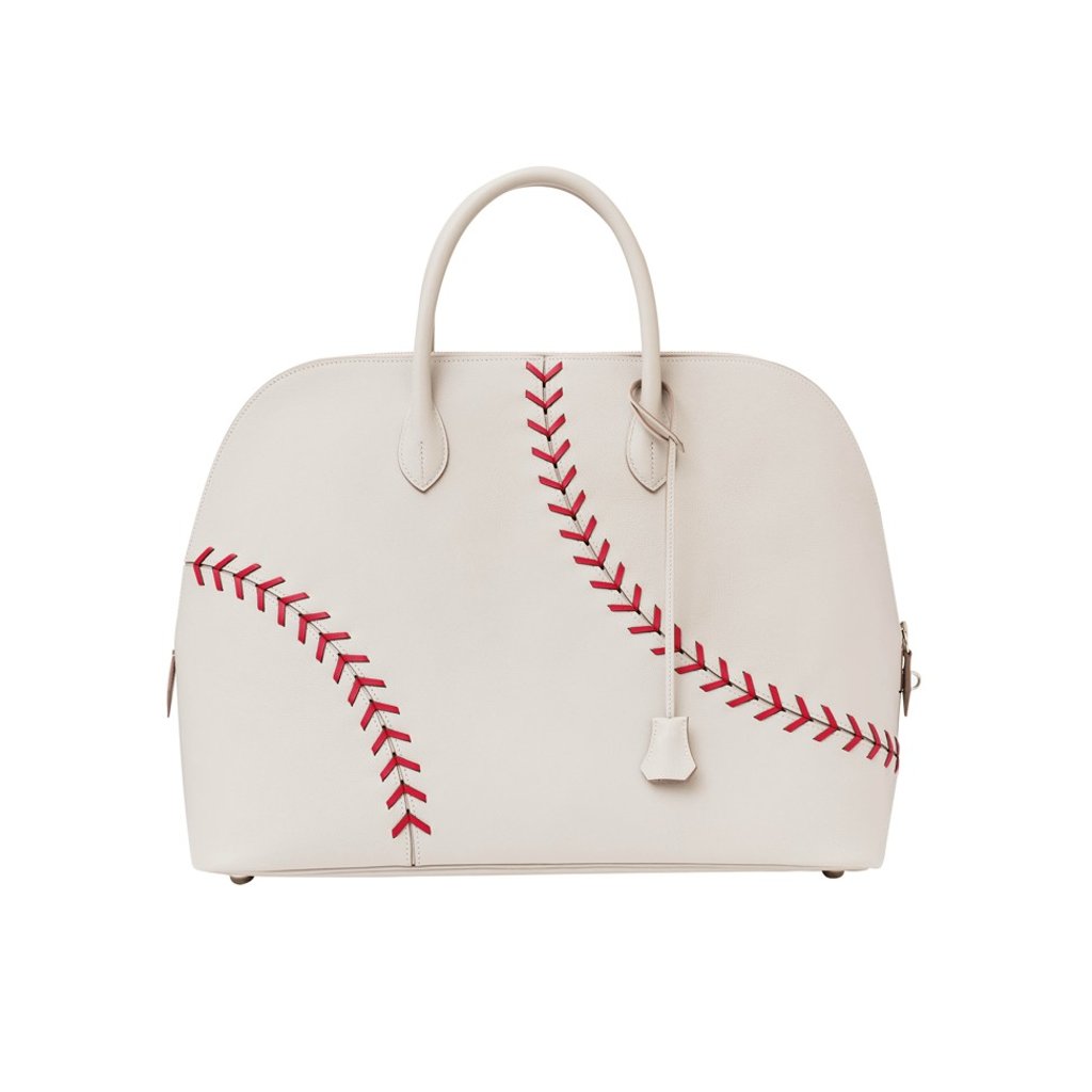 Hermès. A sporty version of the brand’s Bolide Voyage bag, this Bolide 1923 baseball bag, in calfskin, is decorated with leather laces that look like stitches on a baseball, HK$100,900