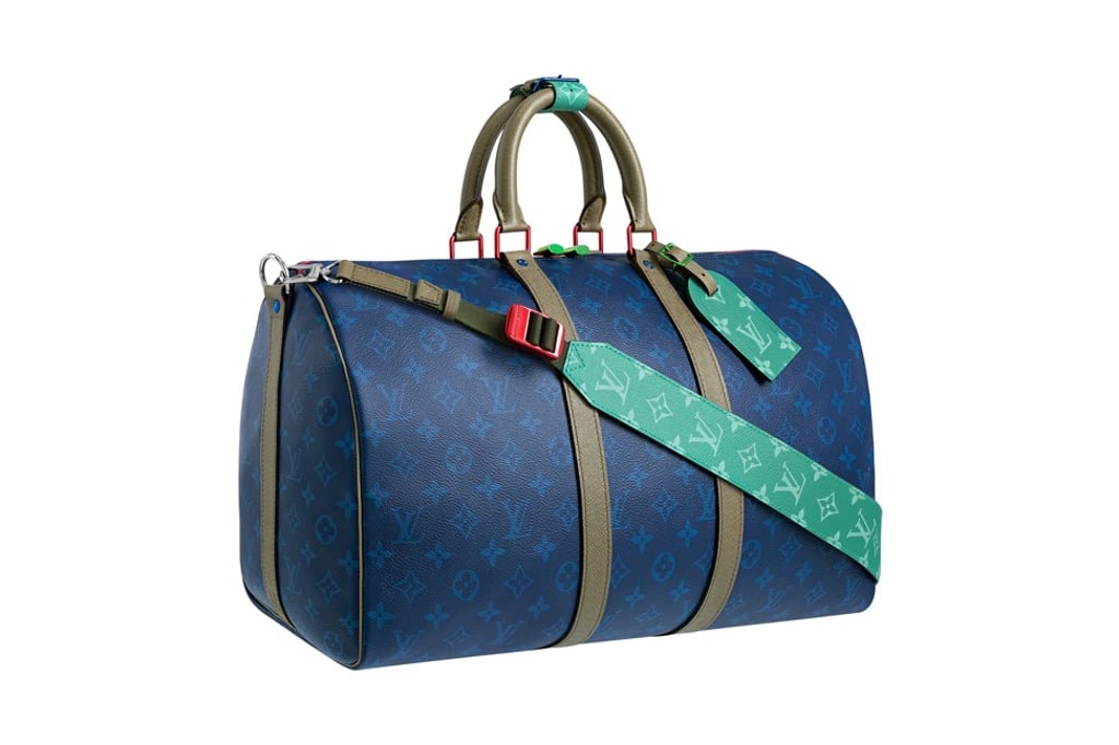 Louis Vuitton. The Keepall Bandouliere 45B bag features Pacific blue monogram canvas and Taiga leather, with metallic pieces in blue, pink, green, gold and silver, HK$18,600