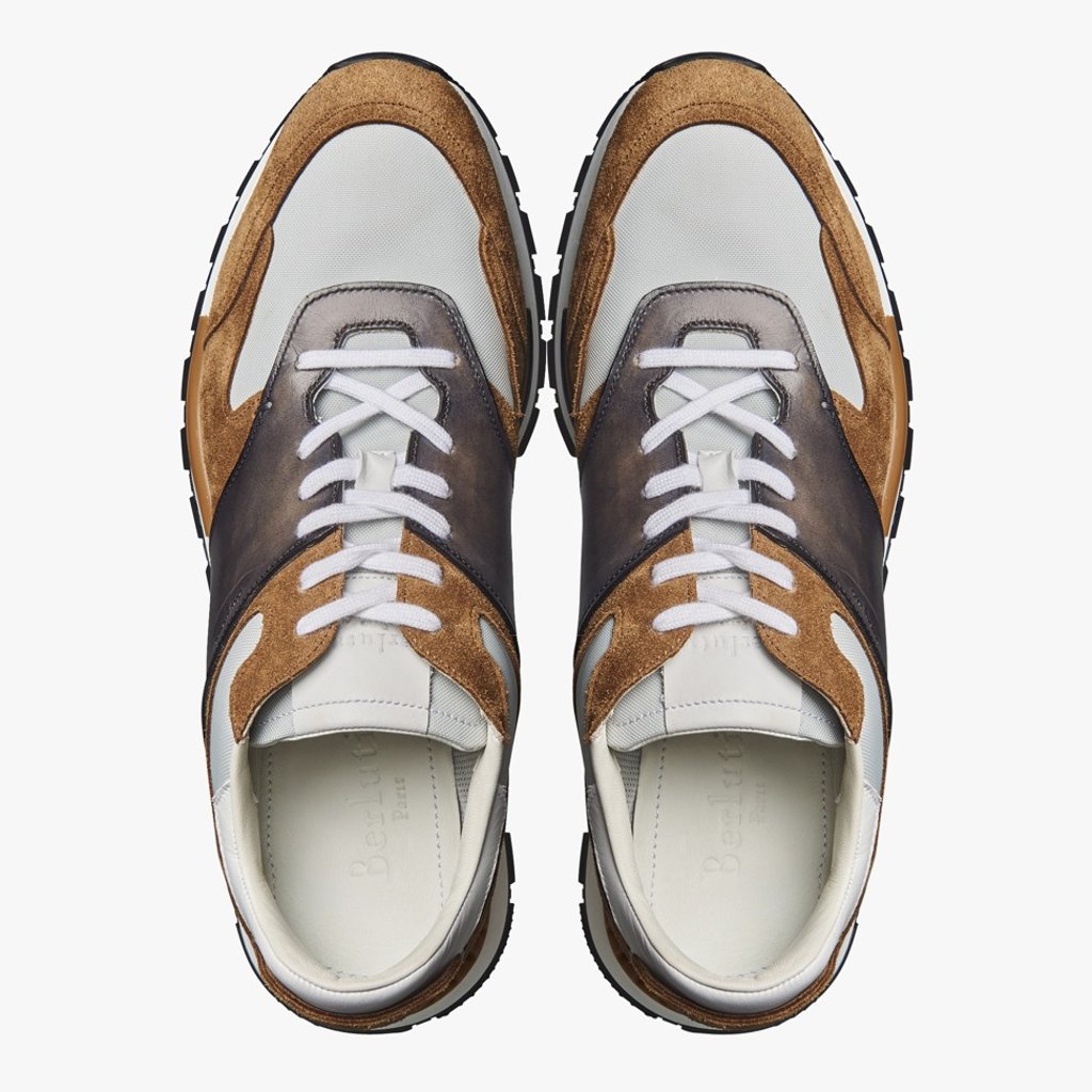 Berluti. The Italian brand embraces the running shoe trend in these Run Track Torino sneakers, in calfskin suede, nylon and Venezia calfskin. The sneakers are the sportier version of the brand’s Fast Track shoes, HK$9,500