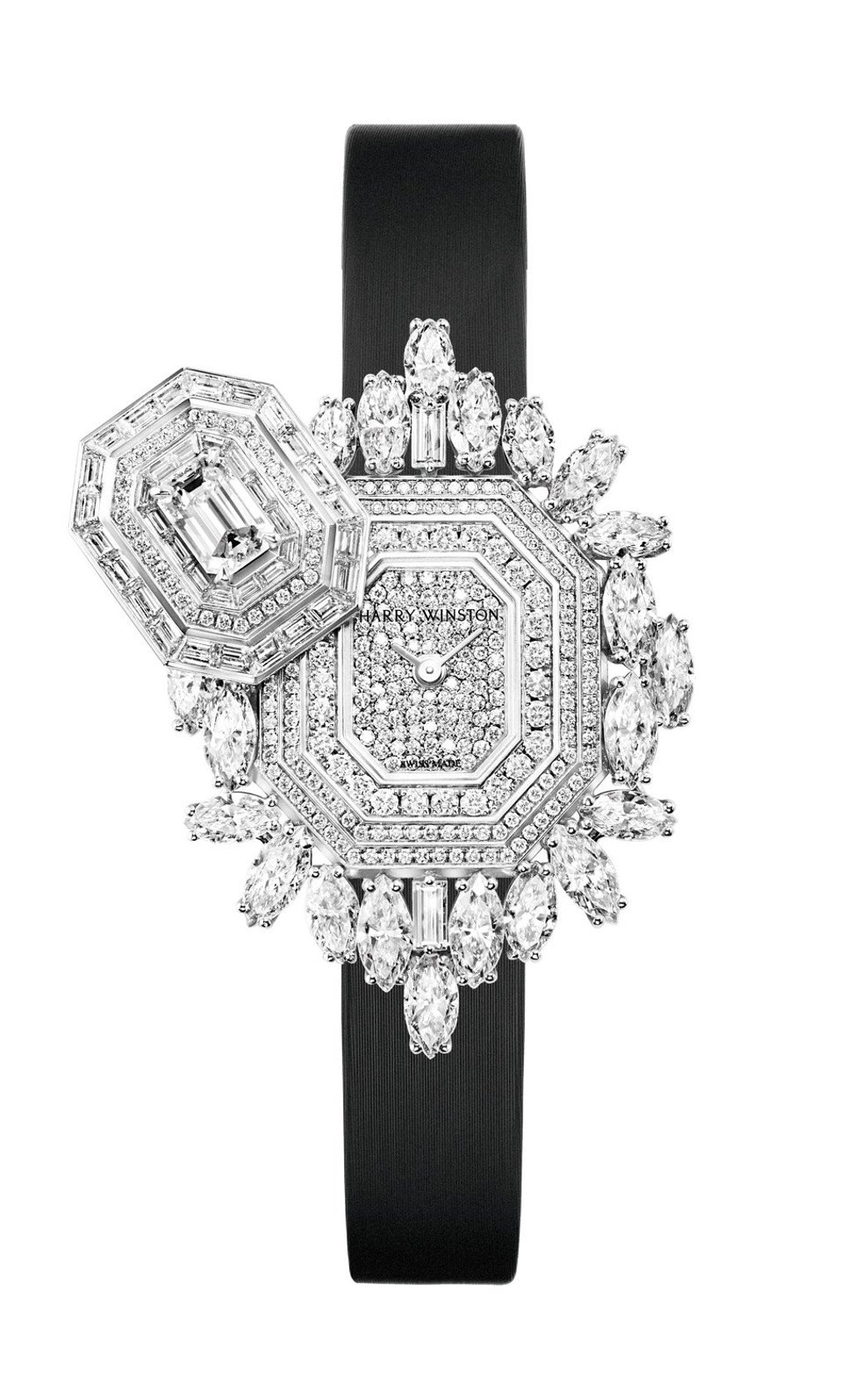 Harry Winston. The Ultimate Emerald Signature watch has a white gold case featuring different shapes of diamonds and a full diamond paved dial. The timepiece, with 9.91ct of diamonds, can also be worn as a pendant, a wristwatch and a brooch. Price on request