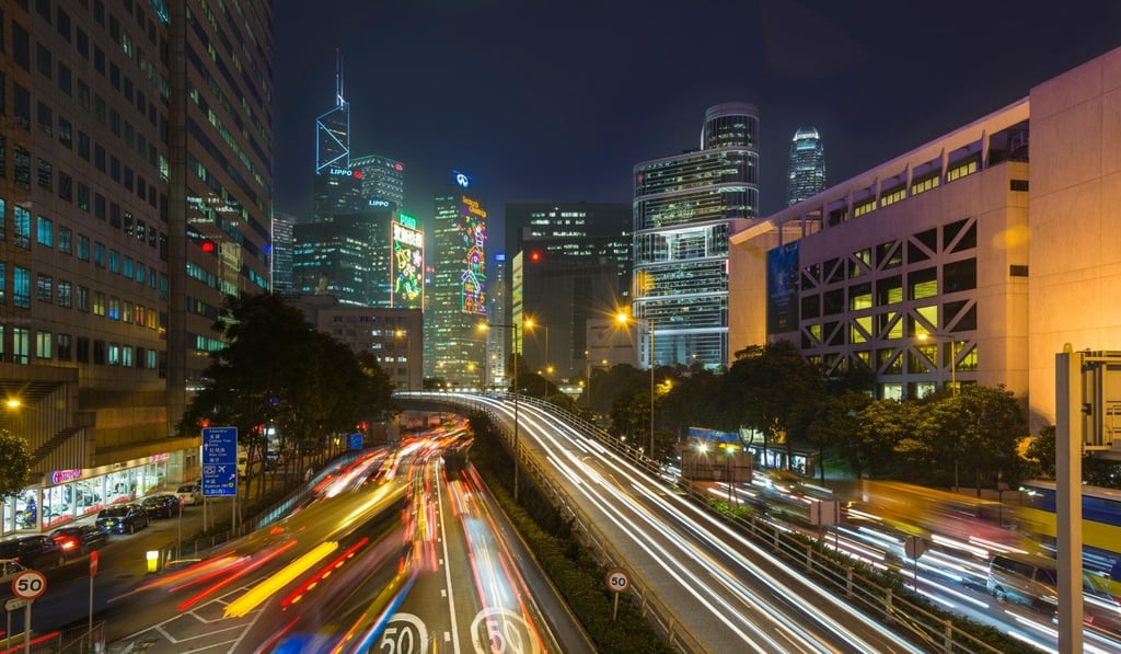 The bright lights of Wan Chai are enticing for tourists. Photo: Alamy