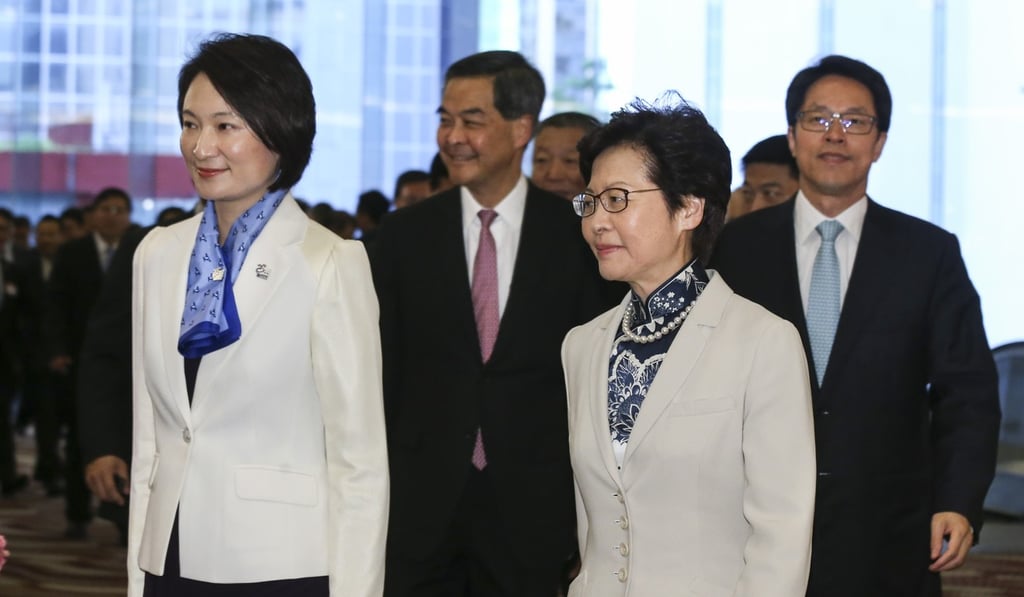 Hong Kong’s Chief Executive Carrie Lam (right) with the chairwoman of the city’s largest pro-establishment party, the Democratic Alliance for the Betterment and Progress of Hong Kong, Starry Lee Wai-king (left). Directly behind Lee is former leader Leung Chun-ying. Photo: Dickson Lee