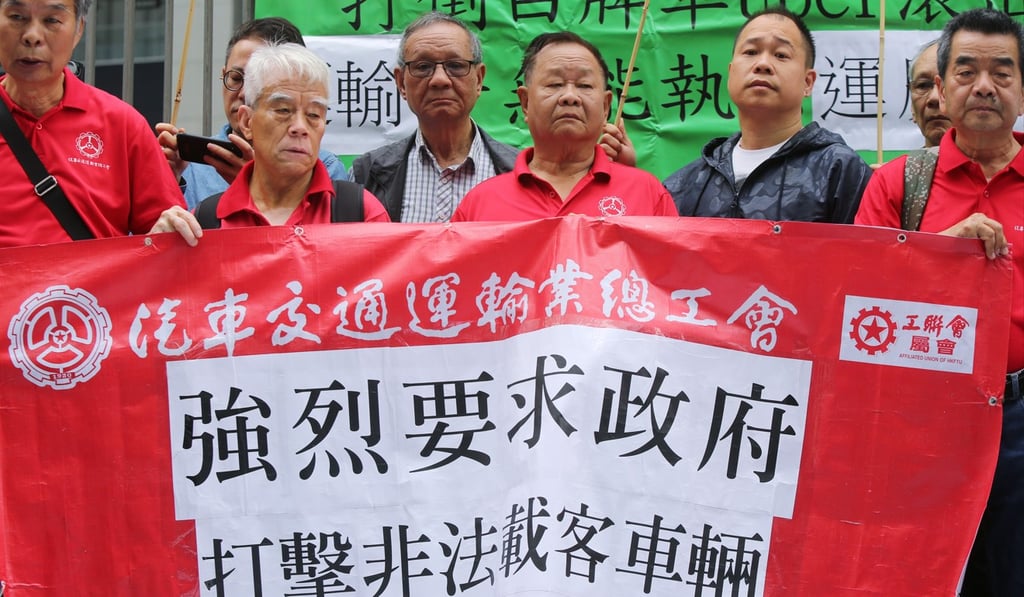 Taxi drivers protest outside the government headquarters in Tamar on March 15, against the perceived lack of a government crackdown on illegal ride-hailing services. Photo: Xiaomei Chen