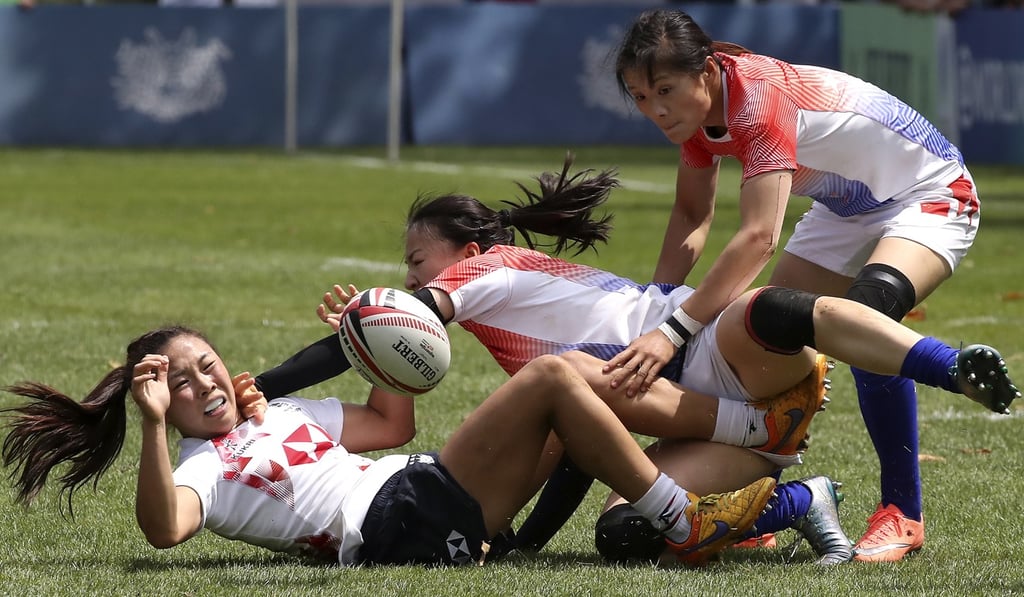 Hong Kong’s Nam Ka-man (left) is under pressure from China’s Chen Keyi and Wang Wanyu. Photo: Edward Wong