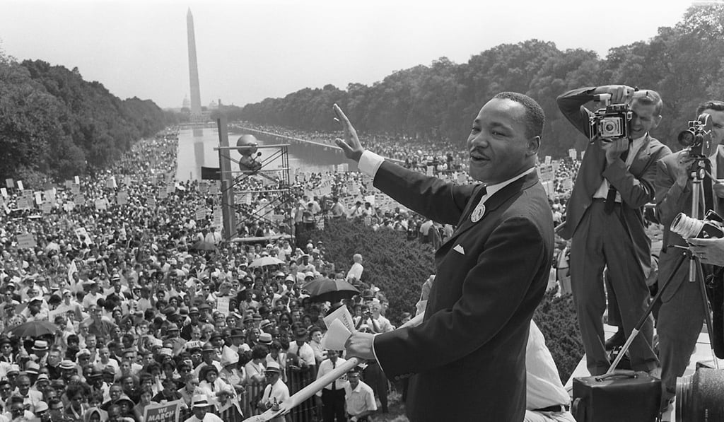 Civil rights leader Martin Luther King waves to supporters during the ‘March on Washington’ on the Mall in Washington on August 28, 1963. Photo: AFP