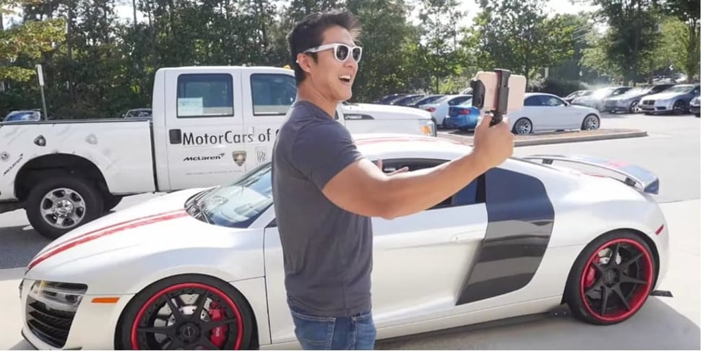 Peter Saddington, pictured beside an Audi R8, who bought a Lamborghini with the riches he made in bitcoin. Photo: YouTube/BiteSizeBitcoin Peter Saddington, pictured beside an Audi R8, who bought a Lamborghini with the riches he made in bitcoin. Photo: YouTube/BiteSizeBitcoin
