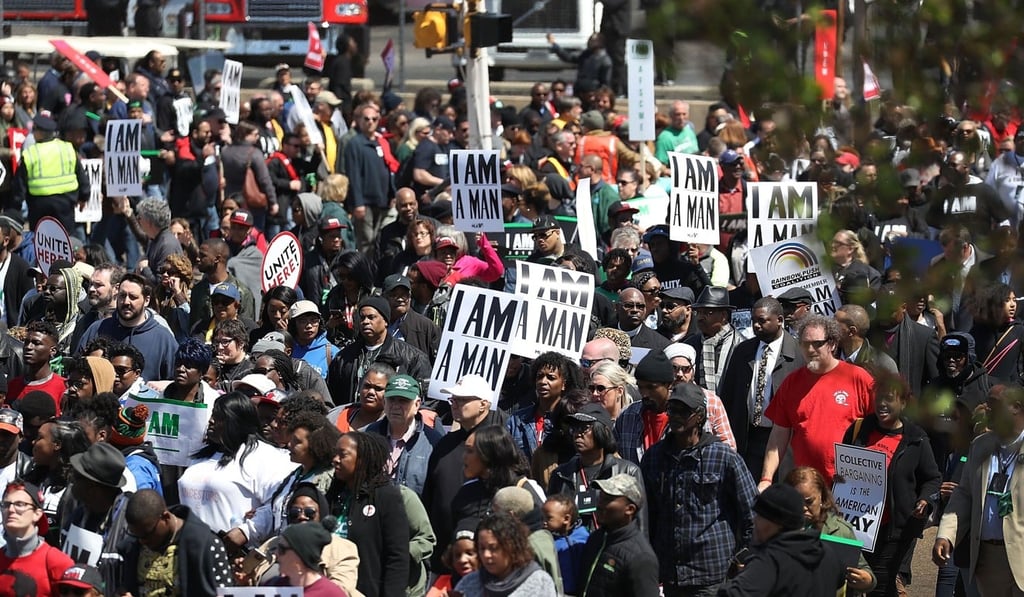 Marchers pass through a Memphis street, holding signs reading ‘I AM A MAN’ - a reference to identical placards held up in the 1968 Memphis sanitation workers’ strike. Photo: Getty Images via AFP