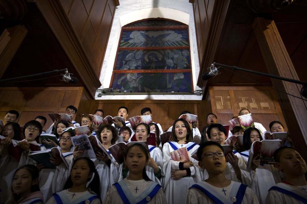 A choir sings during a Mass on Easter Saturday at the government-sanctioned Cathedral of the Immaculate Conception in Beijing. Photo: AP A choir sings during a Mass on Easter Saturday at the government-sanctioned Cathedral of the Immaculate Conception in Beijing. Photo: AP