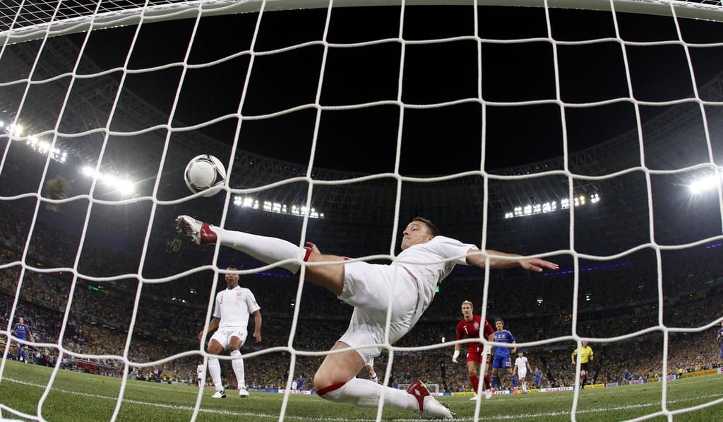 England's John Terry clears the ball away from his goal during the Euro 2012 match between England and Ukraine in Donetsk, Ukraine. Photo: AP