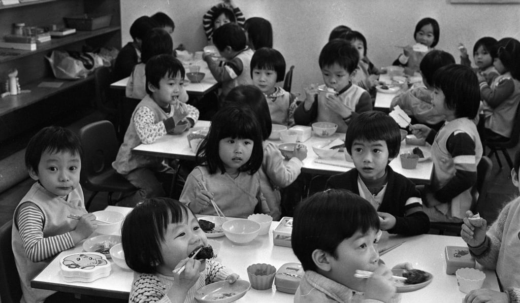 Pupils at Yew Chung Kindergarten enjoy their snacks back in 1979. Photo: SCMP