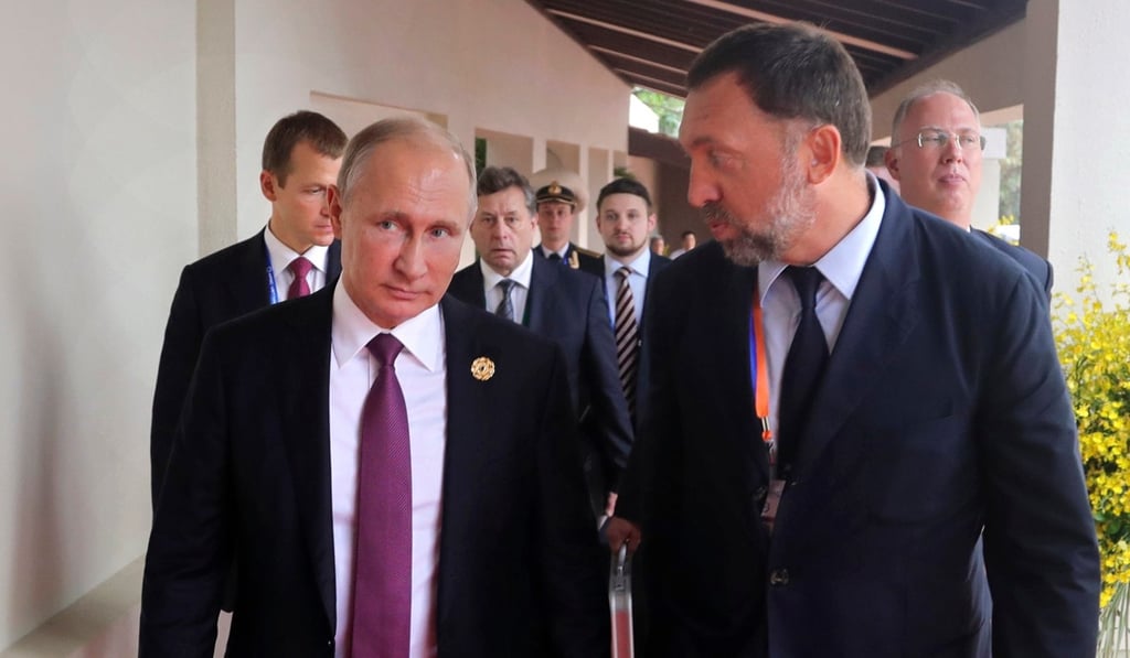 Russian President Vladimir Putin and Russian metals magnate Oleg Deripaska walk to attend the APEC Business Advisory Council dialogue in Vietnam last year. Photo: AP Russian President Vladimir Putin and Russian metals magnate Oleg Deripaska walk to attend the APEC Business Advisory Council dialogue in Vietnam last year. Photo: AP