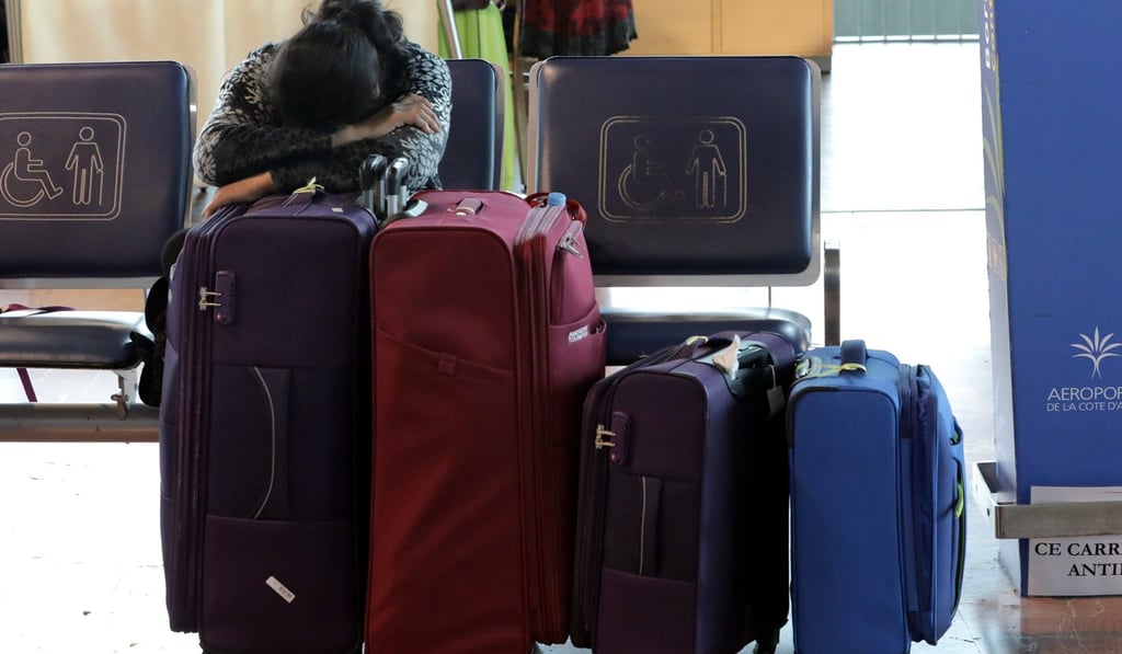 A passenger sleeps at Nice airport as Air France pilots, cabin and ground crews unions call on April 3, 2018 for a strike over salaries. Photo: Reuters